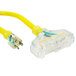 A yellow DuroMax extension power cord with a green and white plug.