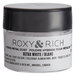 A white container of Roxy & Rich Ultra White Petal Dust with a black lid.