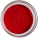 A container of Roxy & Rich Red Rose Petal Dust, a red powder in a jar.