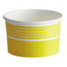 A yellow and white striped paper cup.