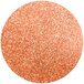 A round orange glitter circle of Roxy & Rich Carrot Lustre Dust.