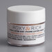 A white container of Roxy & Rich Tender Rose Gold Lustre Dust with black text on the label.