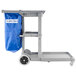 A Carlisle gray janitorial cart with a blue bag.