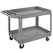 A Carlisle gray plastic utility cart with two shelves and wheels.