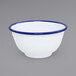 A white bowl with blue rim.