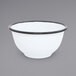 A white Crow Canyon Home enamelware bowl with black rim.