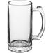 A clear glass mug with a handle.