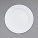 A white Crow Canyon Home enamelware plate with a grey rim.