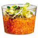 A Solia clear plastic cup filled with salad and vegetables.