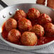 A bowl of Beyond Meat meatballs in tomato sauce.