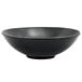 A semi-matte black porcelain bowl with a spiral design.
