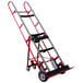 A red and silver metal Wesco Industrial Products appliance hand truck with wheels and a handle.