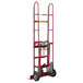 A red Wesco Industrial Products steel hand truck with wheels and a handle.