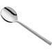 An Acopa Phoenix stainless steel bouillon spoon with a long silver handle.