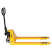 A yellow pallet truck with black handle and wheels.