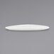 A Front of the House Tides white oval porcelain plate on a gray surface.