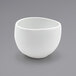 A Front of the House Tides white porcelain bowl on a gray surface.
