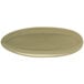 A close-up of a beige oval porcelain plate with a semi-matte finish.