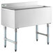 A stainless steel Regency underbar ice bin with sliding lid and bottle holders on a counter.