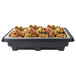 A black plastic tray of food with Sterno SpeedHeat warming system underneath, including chicken and lemon slices.