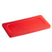 A red flexible plastic lid on a Vollrath steam table pan.
