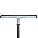 A black and silver Rubbermaid squeegee with a black and silver handle.