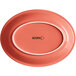 An Acopa coral reef stoneware oval platter with a white border on a pink background.