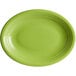 An Acopa Capri bamboo green oval stoneware coupe platter with a rim.
