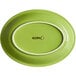 An Acopa Capri bamboo stoneware oval coupe platter with a green center and white rim.