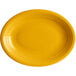 An Acopa Capri mango orange oval stoneware coupe platter with a white background.