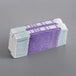A stack of purple and white paper money straps.