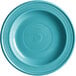 An Acopa Capri Caribbean turquoise stoneware plate with a blue spiral pattern.
