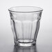 A Duralex Picardie clear glass tumbler with a curved edge on a white background.