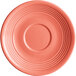 An Acopa Capri coral reef stoneware saucer with a ruffled rim and circular pattern in pink.