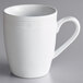 An Acopa Capri white stoneware mug with a handle.