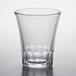 A clear Duralex Amalfi shot glass on a white surface.