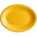 An oval mango orange stoneware platter with a rim.