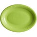 An Acopa Capri green stoneware oval platter with a ring rim.