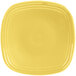 A yellow square Fiesta salad plate with a yellow circle in the middle.