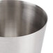 An American Metalcraft stainless steel French fry cup with a handle.