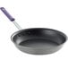 A Vollrath stainless steel fry pan with a purple CeramiGuard II handle.