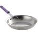 A Vollrath stainless steel frying pan with a purple allergen-free handle.