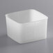 A square white plastic Carlisle food storage container with a lid.
