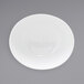 A white oval porcelain bowl with a white rim.