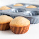 A Fox Run fluted jumbo muffin pan with three muffins in it.