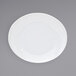 A white Front of the House Ellipse porcelain plate with a small rim.