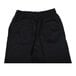 A close up of a pair of black Chef Revival chef pants with side pockets.