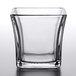 An Anchor Hocking flared square glass votive container.