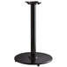 A black Lancaster Table & Seating cast iron counter height table base with a round base.