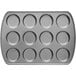 A Wilton muffin top pan with eight molds.